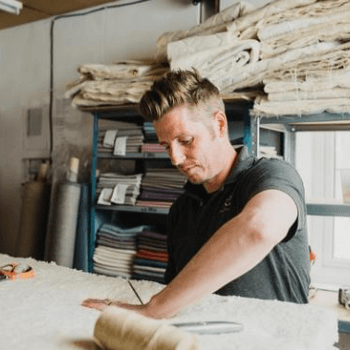 Jamie hand stitching cotton and wool fillings for a Cottonsafe Appledore Mattress