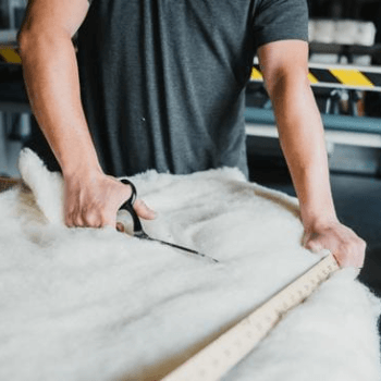 Richard cutting needled organic wool for a Cottonsafe Hatherleigh Mattress